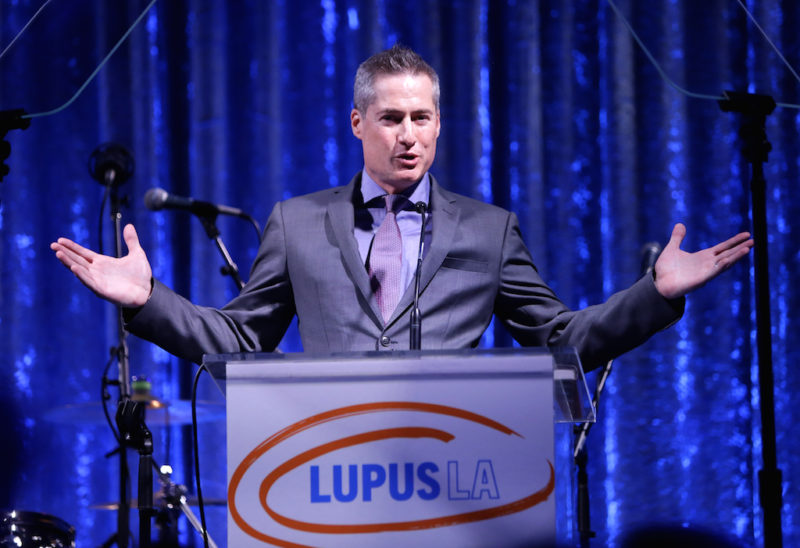 Adam Selkowitz addresses the crowd at the Lupus LA Orange Ball