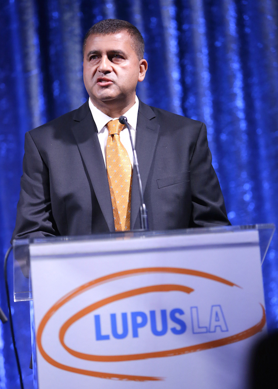 Dr. Ajay Nirula gives a speech at the Lupus LA Orange Ball