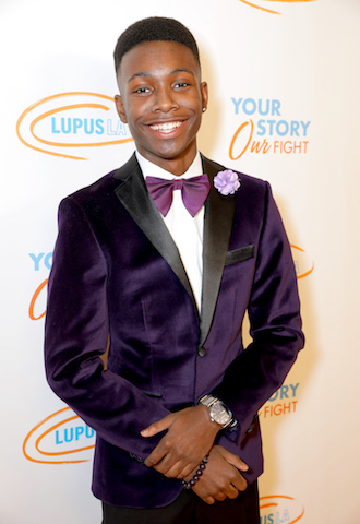 Niles Fitch from This Is Us walks the orange carpet the 2019 Lupus LA Orange Ball.