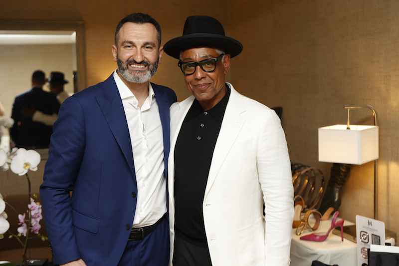Giancarlo Esposito stops by the Jacaob Madani display at DPA's 2022 Pre-Emmy Gift Suite.
