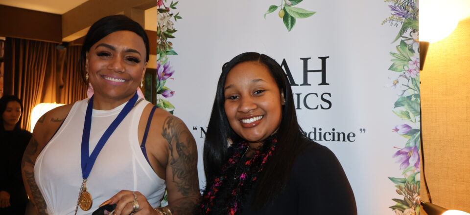 Grammy nominee Queen Sheba stops by the Siyah Organics display at the DPA Music Lounge.