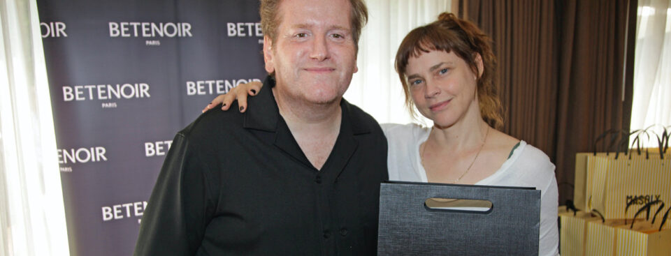 Fiona Dourif receives her gift from Denis Bellaiche of Xions Group at the 2026 DPA Pre-Emmy Awards Gift Suite.